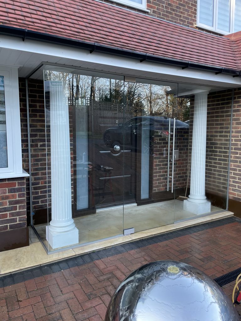 Cobham glass and glazing - an image of a bespoke glass enclosure for a porch produced and installed by Hamilton Glass Products Ltd
