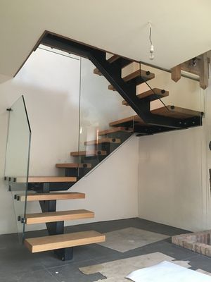 Glass Balustrades and Architectural Glass by Hamilton Glass Products Ltd - an image showing glass supplied and installed for a stairwell balustrade