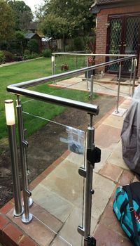 Chertsey glass and glazing - an image of a bespoke external glass balustrade produced and installed by Hamilton Glass Products Ltd