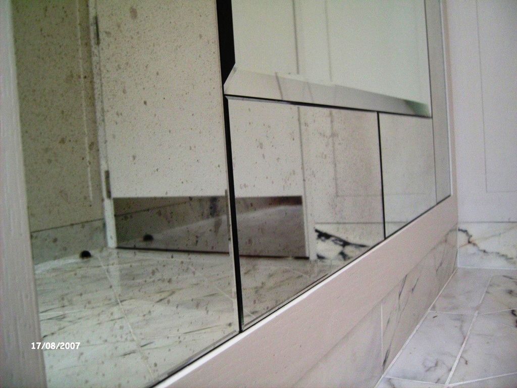 Quality bespoke mirrors - this image shows a bespoke panelled mirror using antique mirror