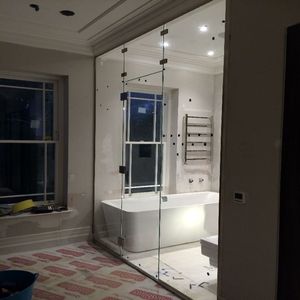 Cobham glass and glazing - an image of a bespoke glass shower enclosure produced and installed by Hamilton Glass Products Ltd